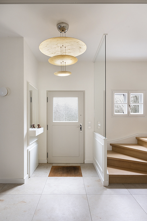 Bright residential interior with clean architectural lines, natural light and minimal design language