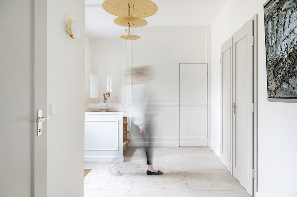 Bright residential interior with clean architectural lines, natural light and minimal design language