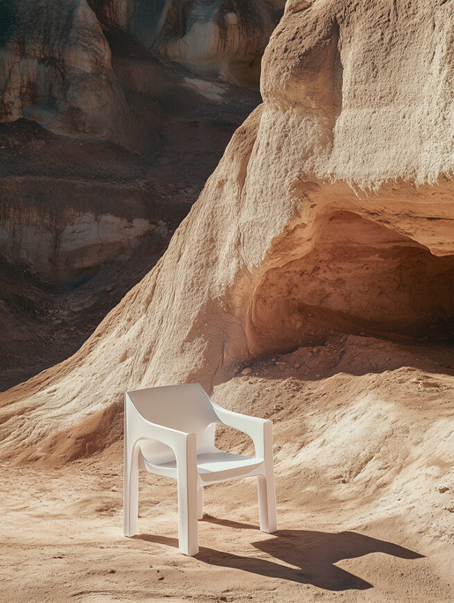 AI generated furniture design scene showing a minimalist wooden chair in a sandy landscape with warm atmospheric light, seating object staged like a sculptural product by AI artist Jelena Filipinski Hamburg