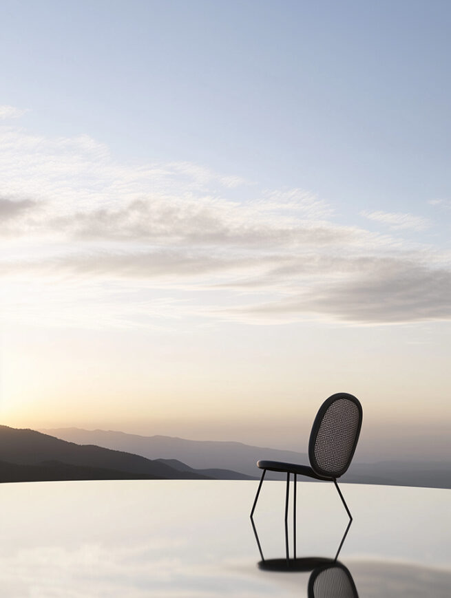 AI generated furniture and seating concept created by AI artist and photographer Jelena Filipinski based in Hamburg. The image shows a minimalist wooden chair staged as a sculptural product object within a sandy landscape. Soft atmospheric light, fine dust in the air and natural shadows create a calm editorial atmosphere inspired by architectural and design photography. The work explores new visual possibilities for furniture, seating and product presentation using artificial intelligence and art directed environments.